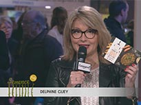 Thumbnail from the video with Delphine Guey's interview at the French Agriculture Fair. Delphine is holding the product box for a lentil steak.