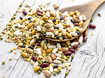 An assortment of pulses spread out on a table