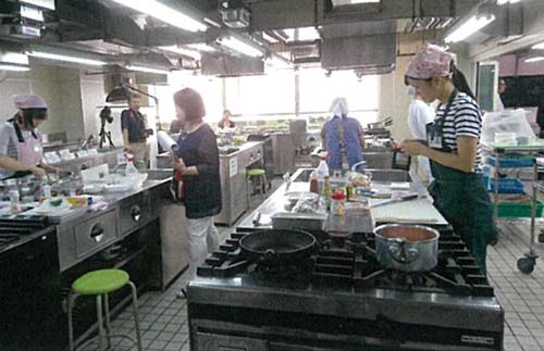 Japanese Chefs cooking in a large kitchen 