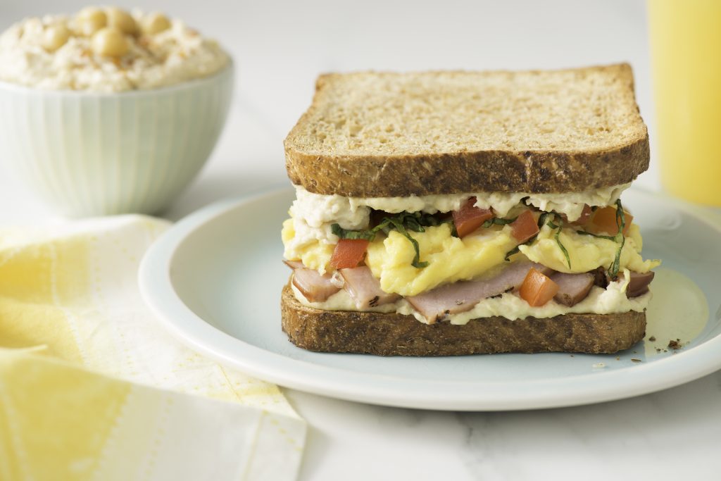 Breakfast Sandwich with Hummus, Scrambled Eggs and Tomato - Half Cup Habit